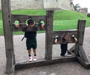 Pilgrims pupils in medieval stocks