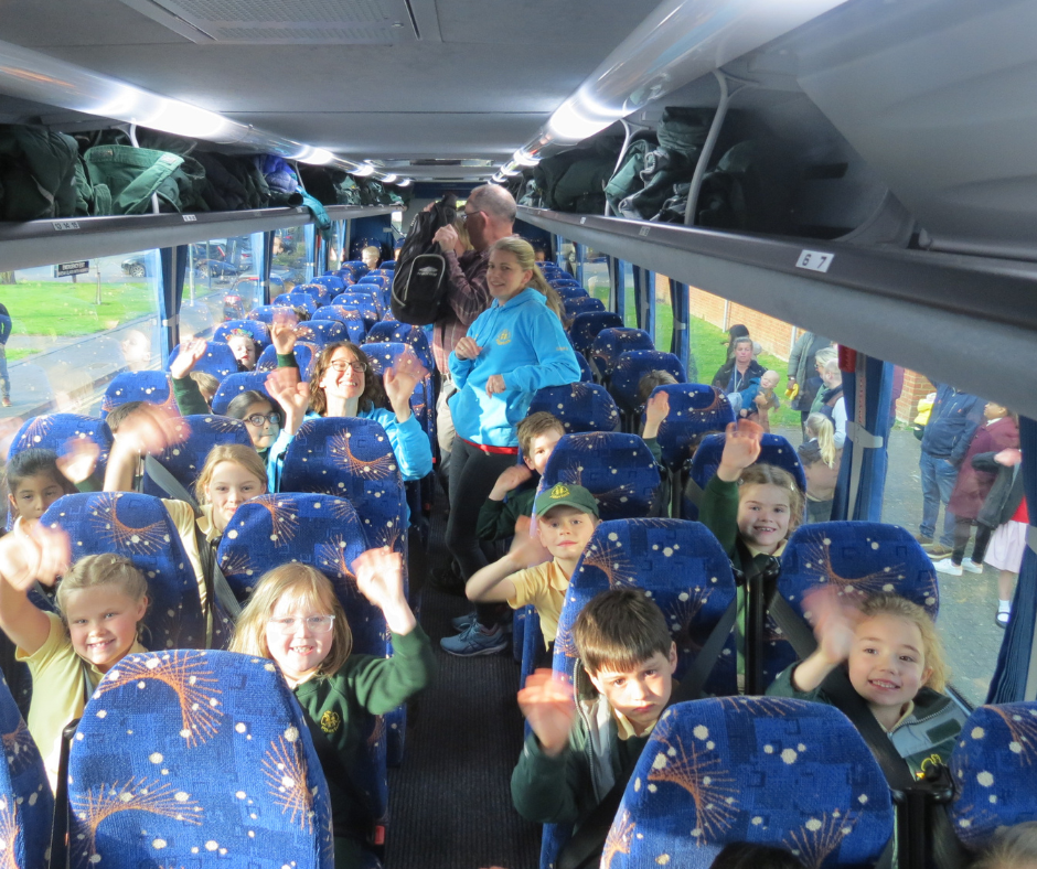 Year 2 pupils on the school bus